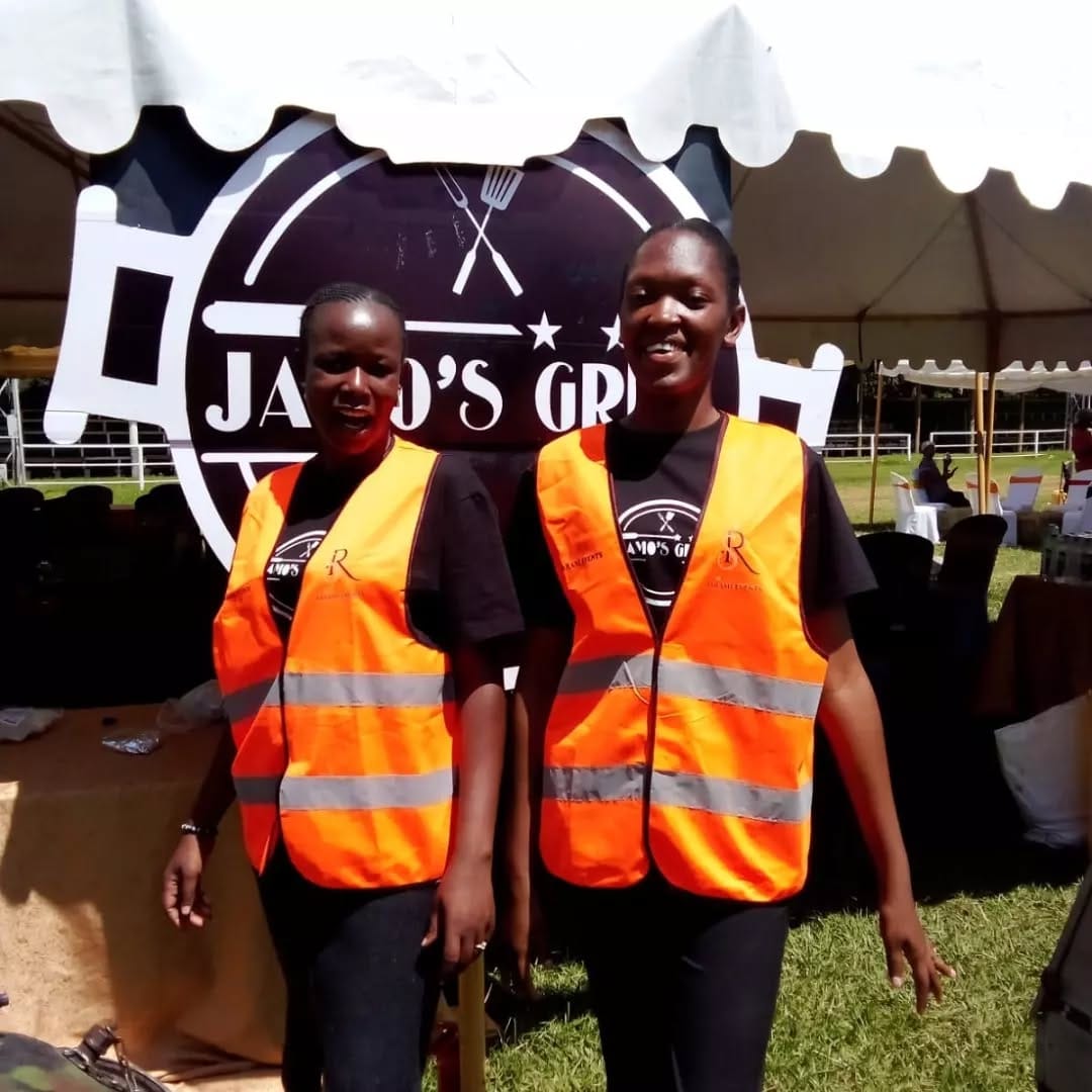 Happy graduate in cap and gown celebrating with friends